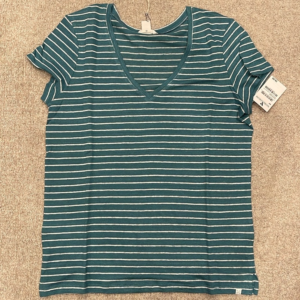 Women’s size petite medium short sleeve shirt with V-neck.
